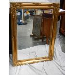 A good gilt framed bevel edged mirror in excellent condition, 85 x 64 cm.