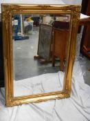 A good gilt framed bevel edged mirror in excellent condition, 85 x 64 cm.