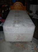 A 3ft divan bed with pine headboard, in clean condition.