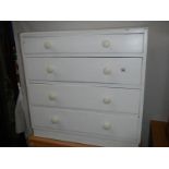 A painted 4 drawer chest.