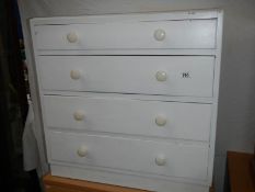 A painted 4 drawer chest.