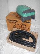 A new (still in box) Panasonic MC-E735 vacuum cleaner with all tools and extra bags.