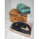 A new (still in box) Panasonic MC-E735 vacuum cleaner with all tools and extra bags.