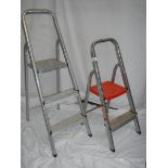 A two step and a three step aluminium ladder.