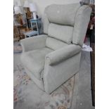 An electric reclining arm chair in good condition.