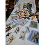 A mixed lot of die cast models and aircraft photographs.