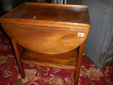 A good mahogany drop leaf trolley with mahogany gallery.