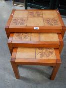 A nest of 3 tiled top tables in good condition.