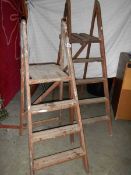 2 old wooden step ladders.