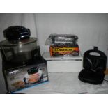 A Daewoo infra red cooker, an electric barbecue grill and a sandwich toaster.