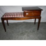 A good red stripe telephone seat in good condition.