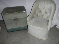 A deep buttoned bedroom chair and a small ottoman.