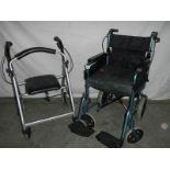 A "Dav's" folding wheelchair with foot rests and a walking aid.