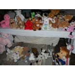A large quantity of soft toys including Bugs Bunny, MIckey Mouse etc., In excess of 30 in total.