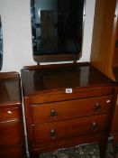 A clean 2 drawer dressing table with mirror back.