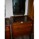 A clean 2 drawer dressing table with mirror back.