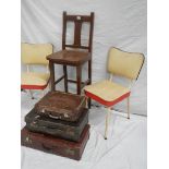 A tall straight backed chair, 2 1960's vinyl chairs and 3 vintage suitcases.