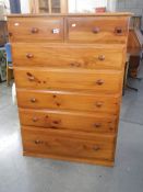A tall 5 drawer pine chest in very good condition.