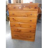 A tall 5 drawer pine chest in very good condition.