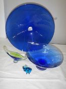 A 40 cm diameter blue glass bowl and other blue glass ware.