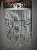 A glass beaded lamp shade, 21 cm diameter, 28 cm long.