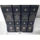 A set of 4 gilded edge Oxford Dictionaries.