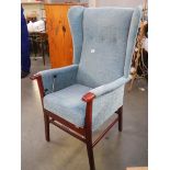 A good quality wing armchair with automatic lifting mechanism.