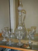 A glass claret jug and set of 6 glasses.
