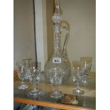 A glass claret jug and set of 6 glasses.