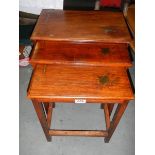 A good nest of 3 teak inlaid tables.