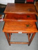 A good nest of 3 teak inlaid tables.