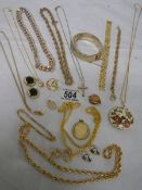 A mixed lot of gold coloured jewellery.