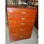 A 5 drawer chest with painted line decoration around drawers.