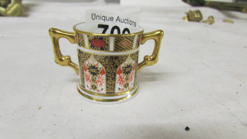 A miniature Royal Crown Derby loving cup in good condition.