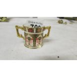 A miniature Royal Crown Derby loving cup in good condition.