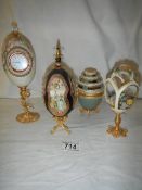 4 decorative collector's eggs in various materials.