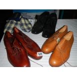 3 good pairs of men's shoes and a pair of slippers.
