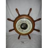 A barometer in the shape of a ship's wheel, 30 cm diameters.