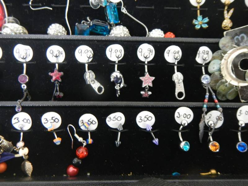 A cabinet of pairs and single earrings. - Image 4 of 5