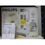 A Philips HR2845 blender with instructions and cook book.