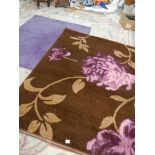 A purple rug 160 x 123 cm and a brown rug 146 x 208 cm.