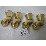 A set of 4 new brass table casters, internal diameter of cup 3.5 cm.