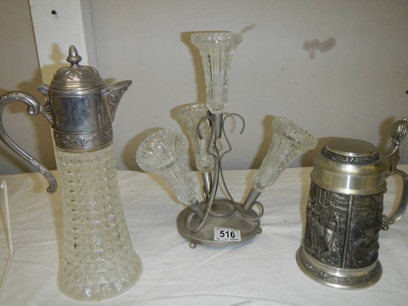 A four trumpet glass and EPNS eperge, a glass claret jug with plated top and a beer stein with stag,