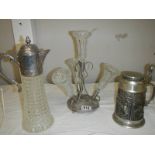 A four trumpet glass and EPNS eperge, a glass claret jug with plated top and a beer stein with stag,