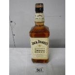 A bottle of Jack Daniels Tennessee Honey Whiskey.