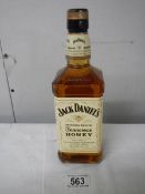 A bottle of Jack Daniels Tennessee Honey Whiskey.