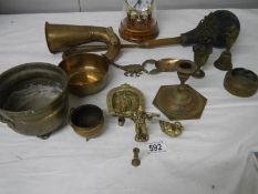 A mixed lot of old brassware, horn works but brass is cracked, also a modern clock.