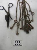 A vintage steel chatelaine with various old keys.