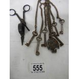 A vintage steel chatelaine with various old keys.