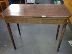 A Victorian mahogany fold over tea table.